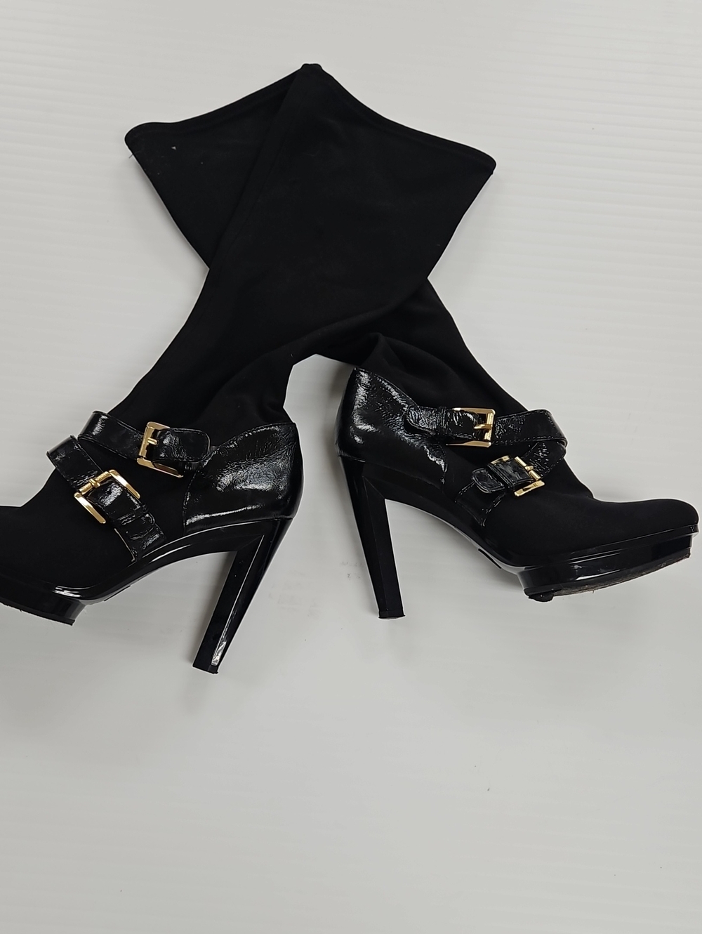 Michael Kohrs Black High Heel Boots with Gold Buckle Detail.